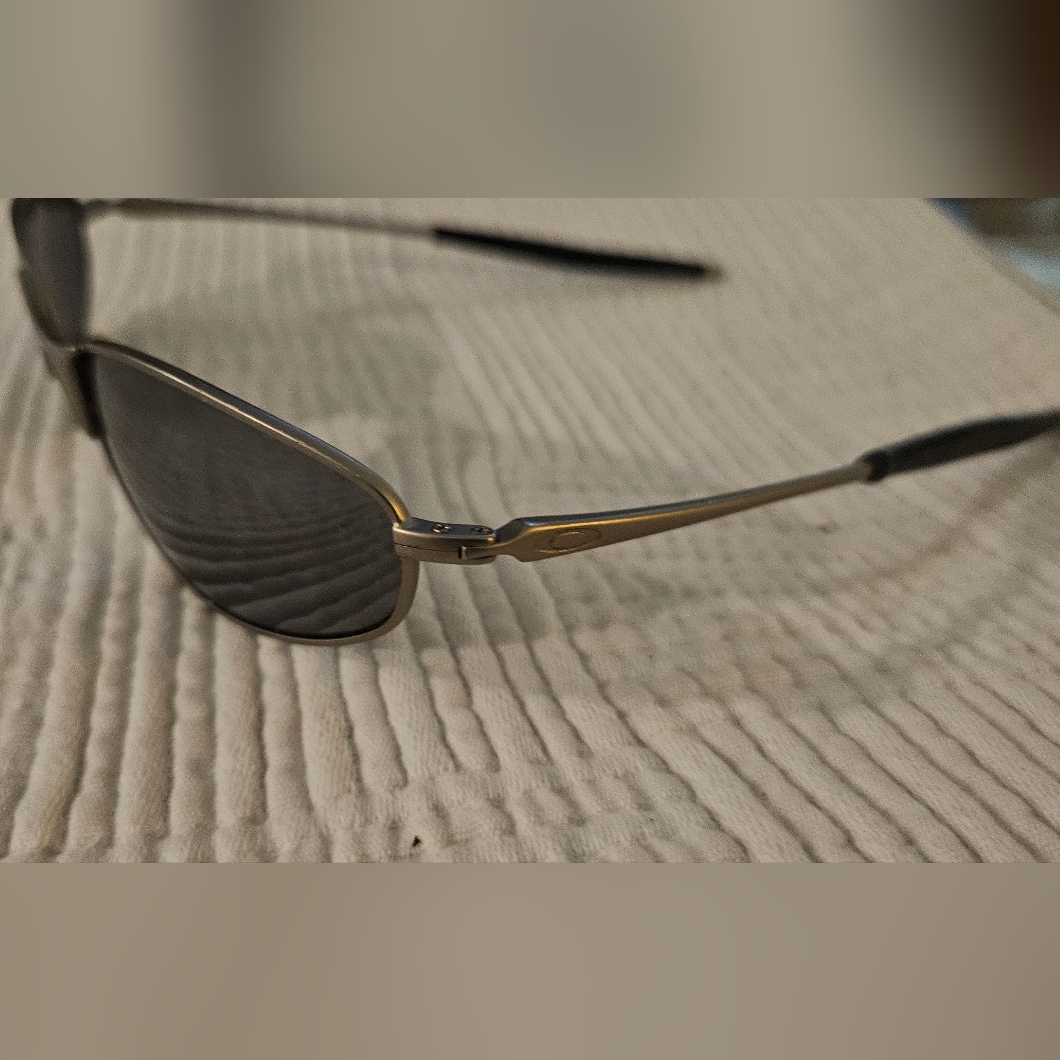 Oakley Silver Sunglasses With Modern Flair